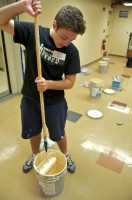 Group 6 teens painted the basement of the Family Life Center of HOPE Ministries homeless shelter and community center. Shown is Ryan Noll of St. Vincent de Paul in Fort Wayne.