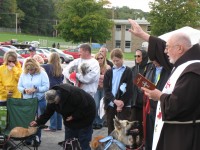 Father Jim Kendzierski blesses the entire crowd gathered for the feast of St. Francis of Assisi.