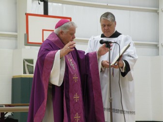 Bishop John M. D’Arcy joins students from St. Joseph School, and parishioners and donors of St. Mary of the Assumption Parish in Decatur to bless the new $1 million gymnasium. 