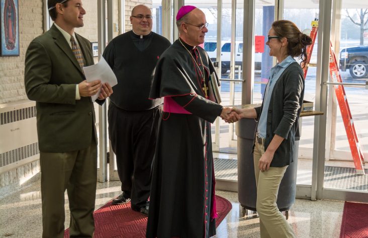 Bishop Rhoades makes pastoral visit, announces patron saint, confirms student
