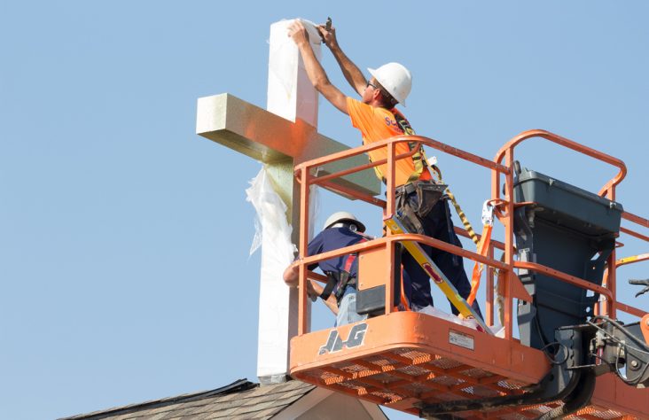 Divine Mercy Funeral Home raises crosses