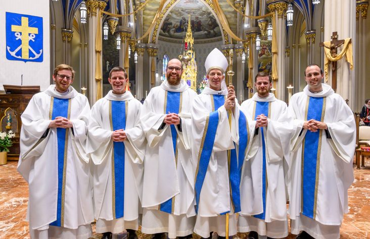 Five ordained Holy Cross priests