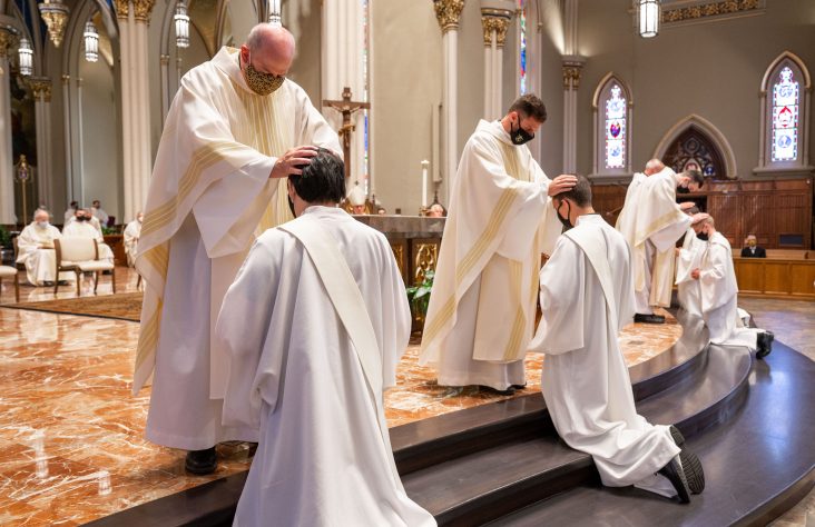 Eight Holy Cross brothers ordained deacons, priests