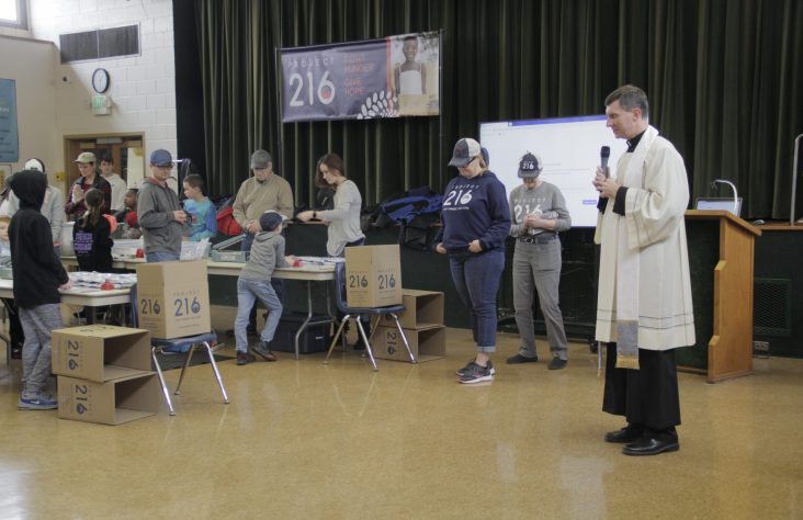 Volunteers pack 28,000 meals for Poland
